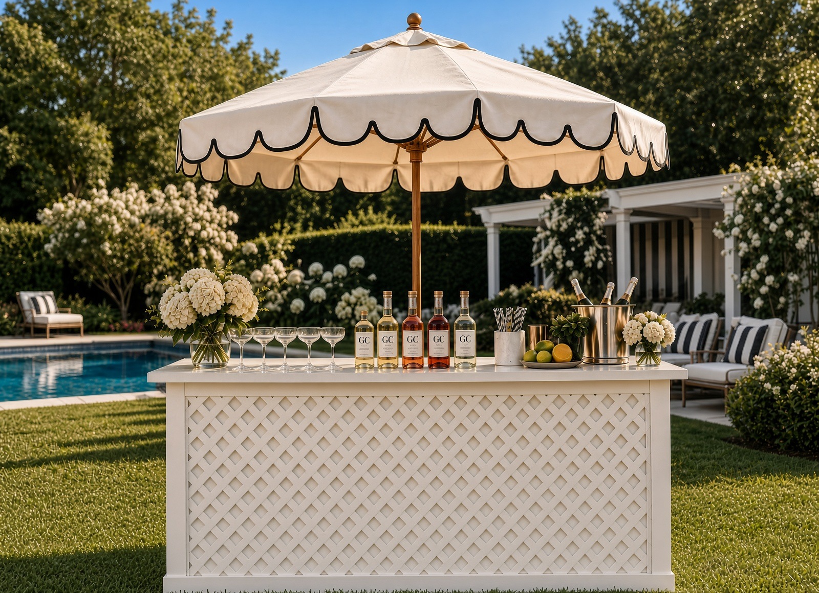 White lattice cocktail cart with scalloped umbrella and GC Pop bottles, poolside